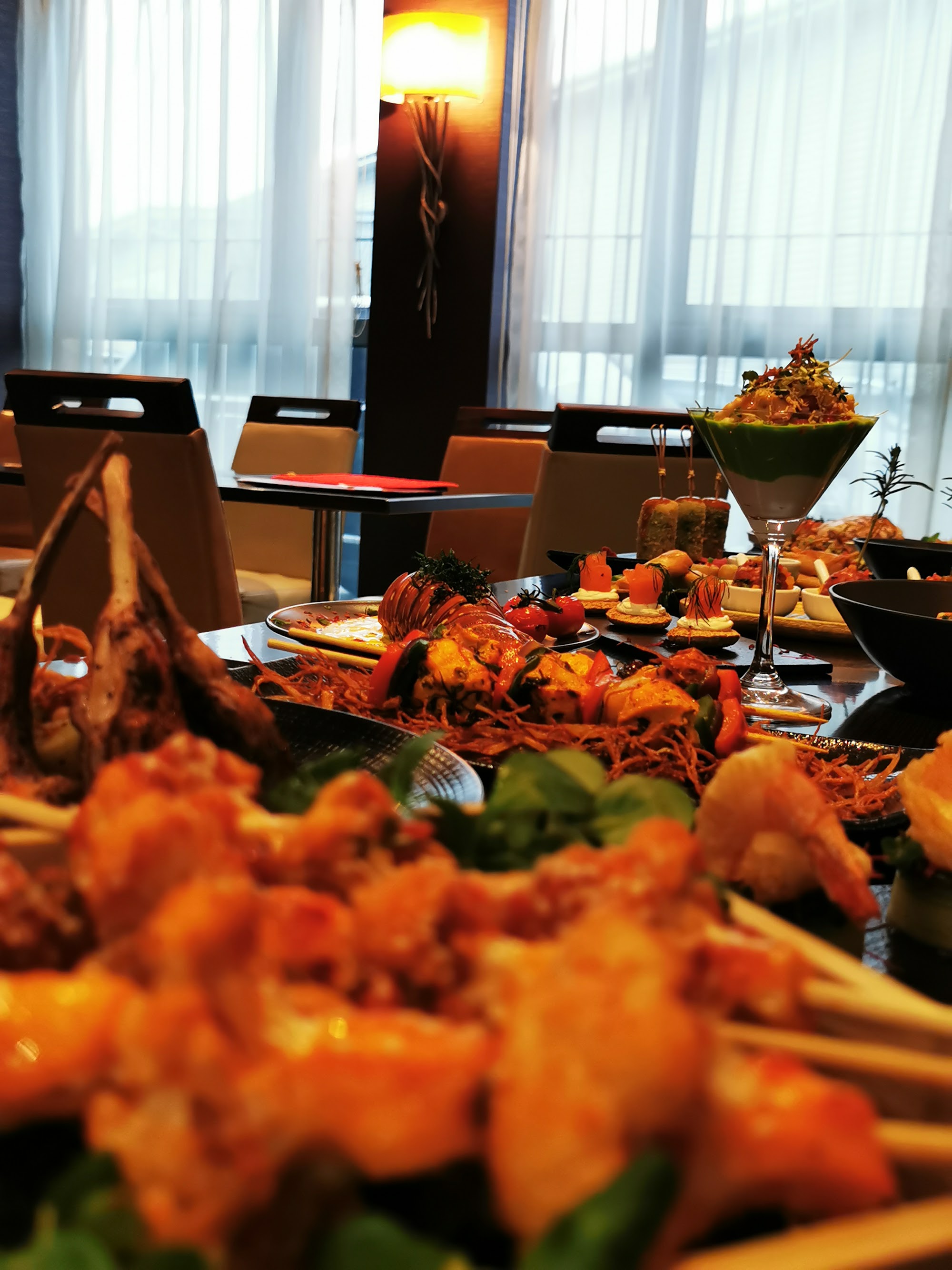 A catered table with skewers and creatively presented appetisers